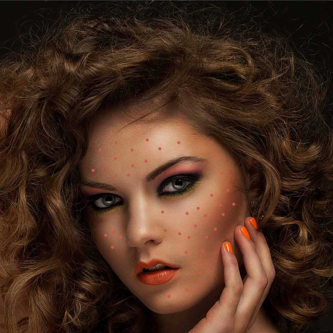 Beautiful caucasian woman with curls and evening makeup